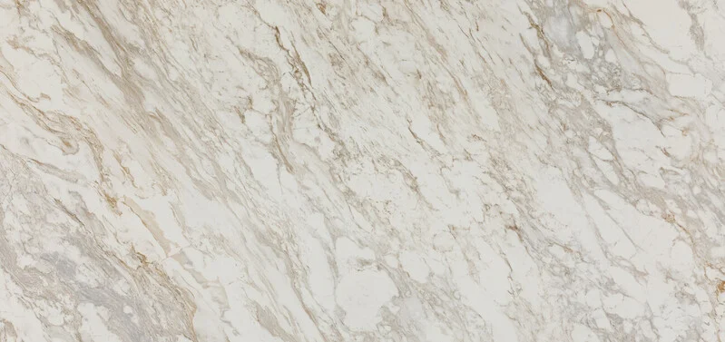 White marble surface with gray and beige veining patterns.