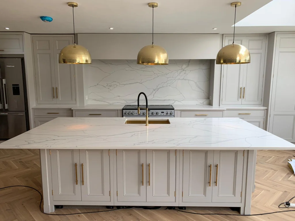Matching stone splashback behind a kitchen worktop