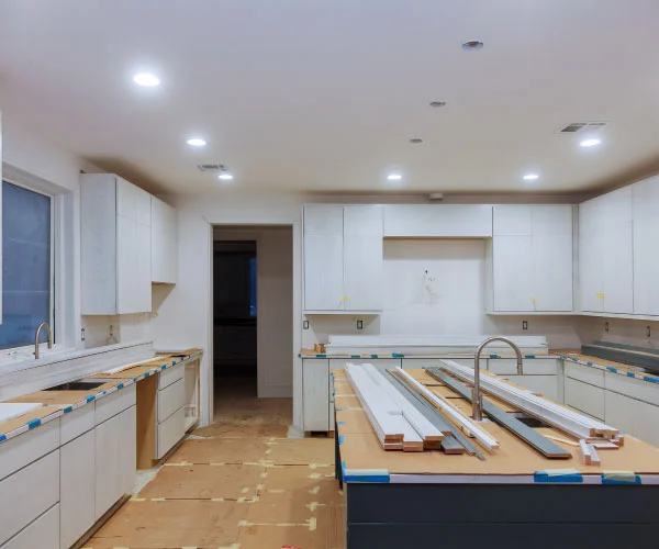 Kitchen being fitted, with cabinets in place before the worktops.