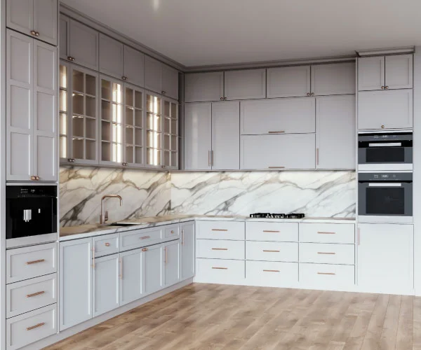 Grey shaker kitchen with a white veined stone worktop and splashback.