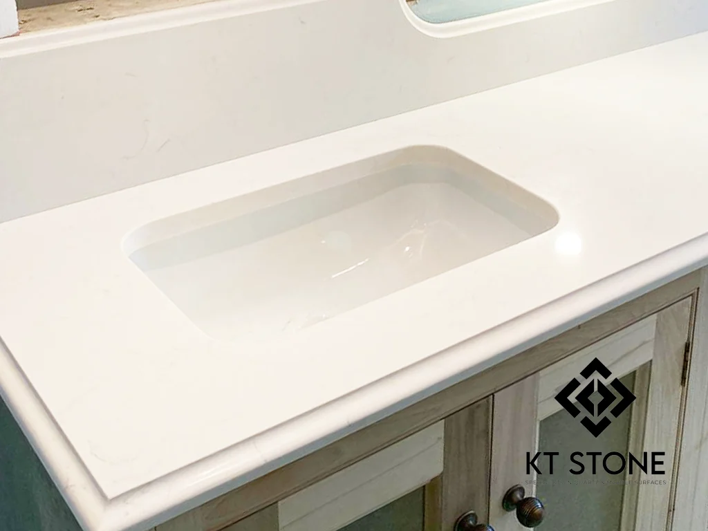 White quartz worktop with an undermount sink, from a KT Stone project in London.