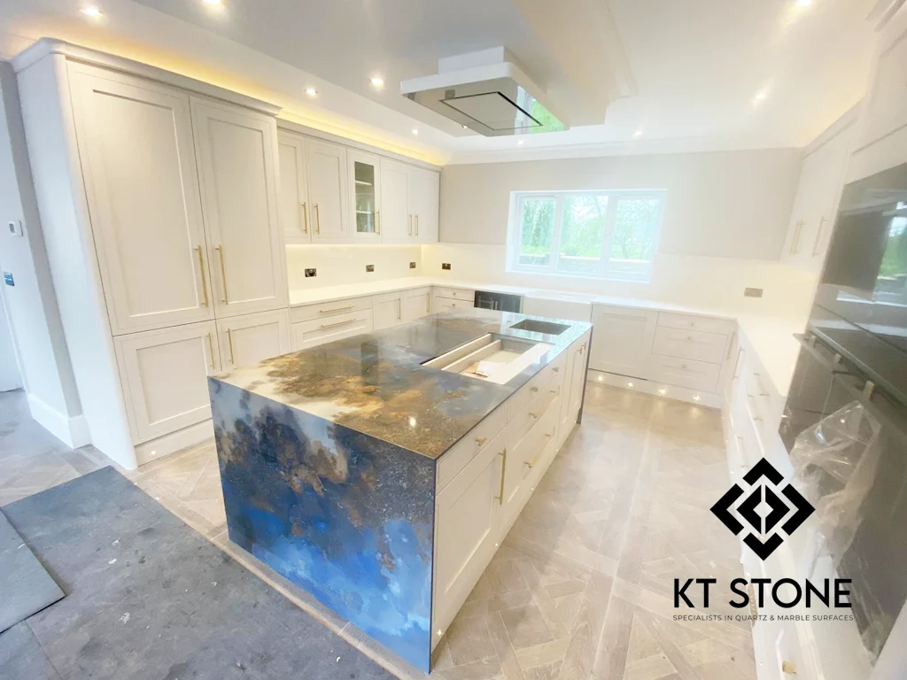 Blue-and-gold marble kitchen island from a KT Stone project in London.