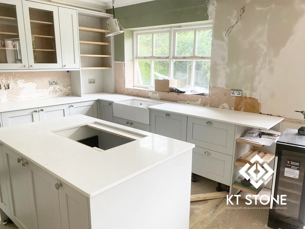 White quartz kitchen worktops and island from a KT Stone project in London.