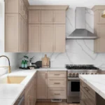 Light kitchen with quartz worktops and matching splashback